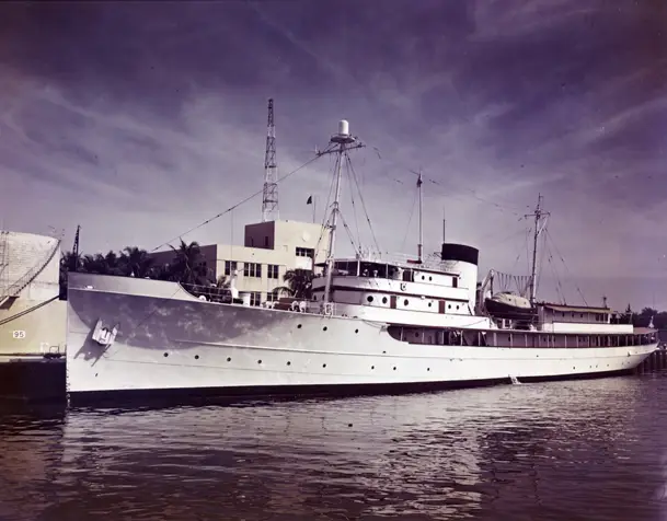 president harry s. truman's yacht, the uss williamsburg, sitting in a port 1947 copy